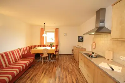 a living room with a couch and a table at Tomasoethof in Castelrotto