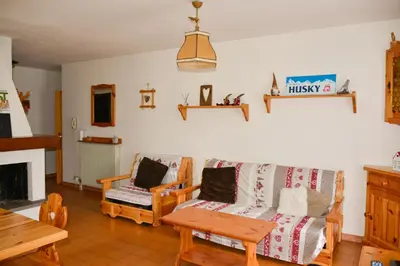 a living room with a couch and a table at CASA GILDA Val di Fiemme - Dolomiti in Cavalese