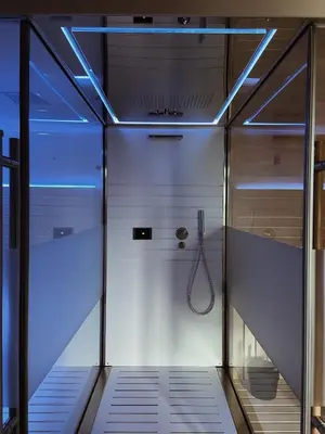 a walk in shower with a glass door at Apartmenthotel Ritterhof Suites & Breakfast in Schenna
