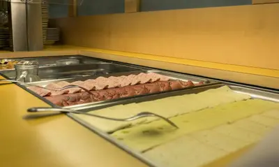a tray of meat and cheese on a counter at Drei Birken in Soprabolzano