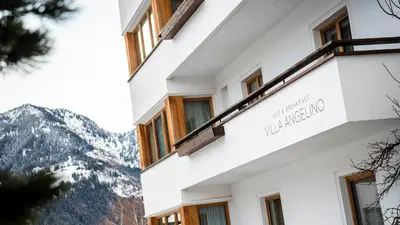 a hotel with a view of the mountains at B&B Villa Angelino in Ortisei