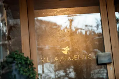 a glass door with the words villa angeling on it at B&B Villa Angelino in Ortisei