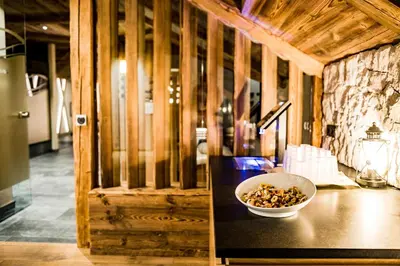 a bowl of nuts sitting on top of a counter at Hotel Vernel in Santa Cristina in Val Gardena