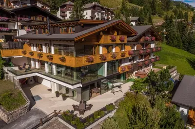an aerial view of a house with a balcony at Hotel Garnì Gardena - Appartments in Santa Cristina in Val Gardena