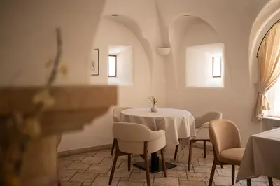 a dining room with a table and chairs at Vitalpina Hotel Schulerhof in Plaus