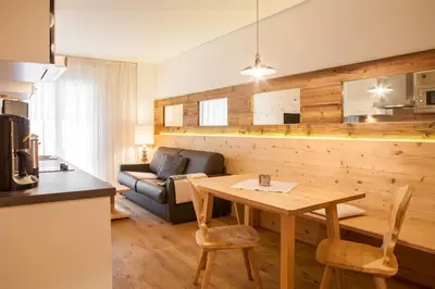 a living room with a table and a couch at Agriturismo Sittnerhof in Merano