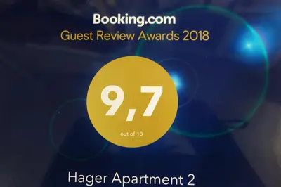 a poster for a guest review awards with a yellow circle at Hager Apartment 2 in Merano