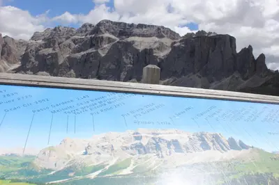 a view of a mountain from behind a window at Villa Martha Vintage Hotel-B&B in Santa Cristina in Val Gardena