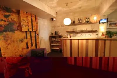 a bar in a restaurant with a counter in a room at Garni Ortles in Selva di Val Gardena