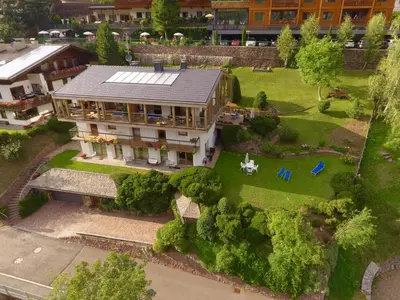 an aerial view of a large house with a yard at Residence Larciunei in Ortisei