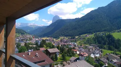 a view of a town in a valley with mountains at Residence Larciunei in Ortisei