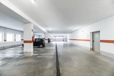 an empty garage with a car parked in it at Residence Rumanon in Ortisei