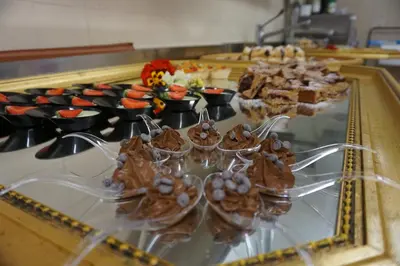 a buffet with desserts and other foods on a table at La Palsa in La Valle