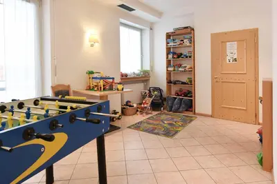 a room with a table with toys on it at Alpin-Residence Amadeus in Siusi
