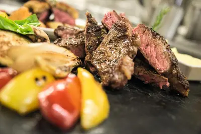 a pile of meat and vegetables on a table at Das Mondschein in Obereggen
