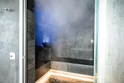 a shower with smoke coming out of it at Das Mondschein in Obereggen