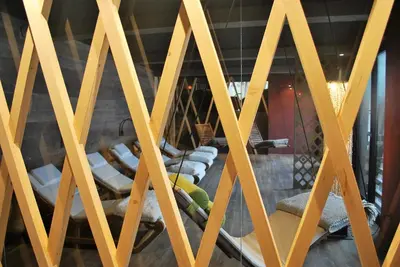 a gymnasium with yellow wooden beams at Das Mondschein in Obereggen