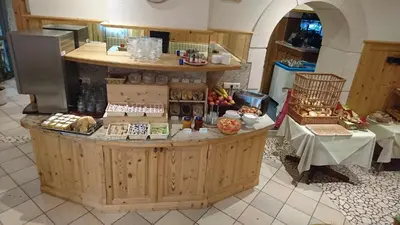 a kitchen with a counter with food on it at Hotel Stamserhof in Andrian
