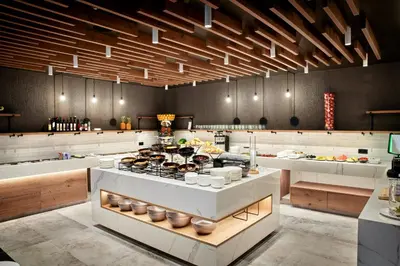 a kitchen with a stove with food on it at Hotel Das Sonnenparadies in Schenna