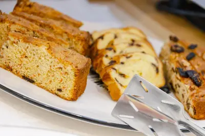 a plate with slices of bread and a knife at Hotel Ramon in Campitello di Fassa