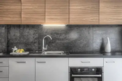 a kitchen with a sink and wooden cabinets at Apartments Haus Gabi in Laion