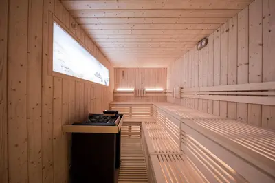 a sauna with wooden walls and a window at Lamondis in Castelrotto