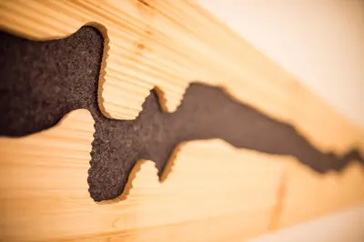 a black cookie cutter on a wooden table at Hotel Restaurant Waldbichl in Verano