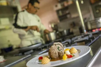a plate of food on a counter in a kitchen at Pension Prack in Brunico