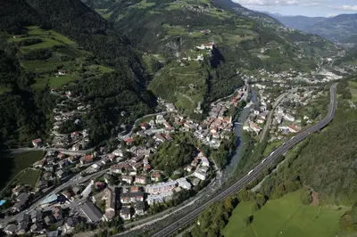 an aerial view of a town in the mountains at Parkhotel Post in Chiusa