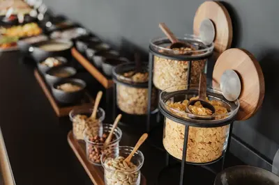 a group of jars filled with food on a table at Luxury B&B August in Ortisei