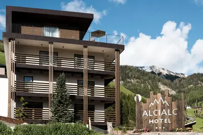a hotel with a sign in front of it at Hotel Alcialc in La Valle