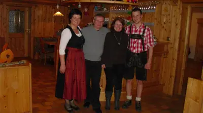 a group of people posing for a picture in a cabin at Hotel Alcialc in La Valle