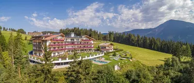 an aerial view of a resort in the mountains at Hotel Scherlin in Ortisei