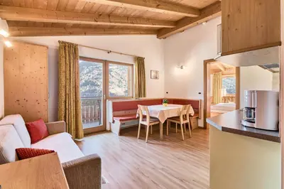 a living room with a couch and a table at Residence Schiestlhof in Naz-Sciaves