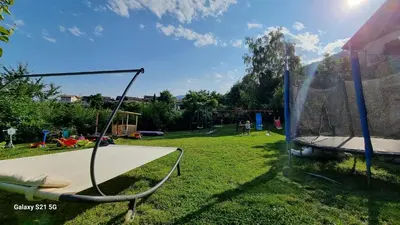 a playground with a trampoline in a park at Laimerhof in Rifiano