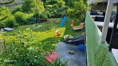 an aerial view of a backyard with a playground at Laimerhof in Rifiano