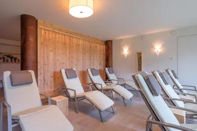 a row of chairs in a waiting room at Gasthof Löwen in Nova Levante