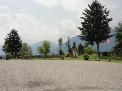 a park with a playground and a slide at Garni Schneeburghof in Tirolo