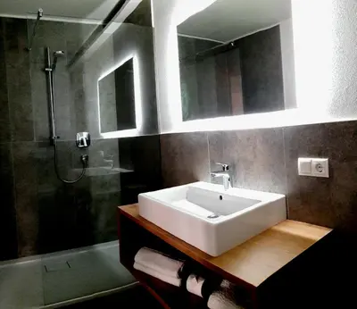 a bathroom with a sink and a shower at Appartment Charly in Siusi