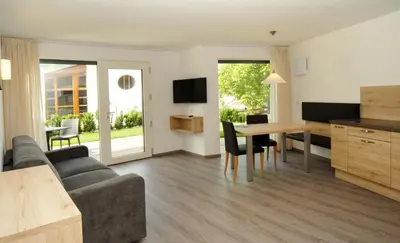a living room with a couch and a table at Appartment Charly in Siusi