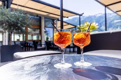 two wine glasses sitting on top of a table at Hotel Belvedere - Adults Only - 14 plus in Naturno