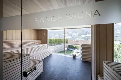 a row of benches in a church with a view at Hotel Belvedere - Adults Only - 14 plus in Naturno