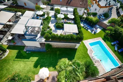 an aerial view of a swimming pool in a yard at Hotel Belvedere - Adults Only - 14 plus in Naturno