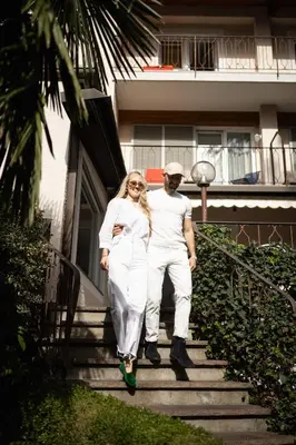 a man and a woman walking down some stairs at Weingarten Terlan - Rooms & Breakfast in Terlano