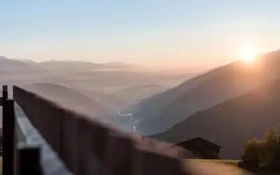 a view of a mountain with the sun in the background at Hotel Ambet in Maranza