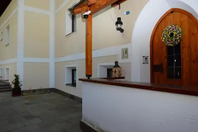 a large room with a large wooden door in a building at Residence Granvara in Ortisei