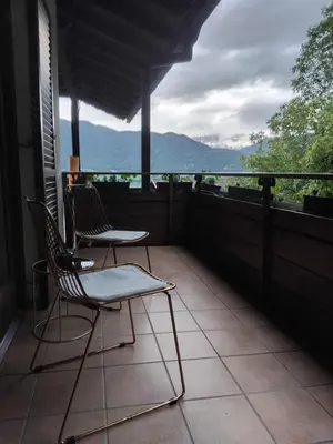 two chairs sitting on a balcony with a view at Biogasthaus Plonerhof 