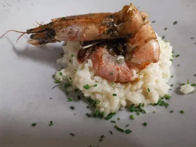 a piece of shrimp on a pile of rice at Hotel Klammer in Vipiteno
