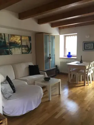 a living room with a couch and a table at Lausen Vil in Canale San Bovo