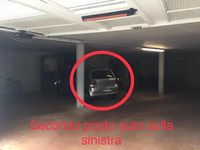 a car parked in a parking lot in a garage at Lausen Vil in Canale San Bovo